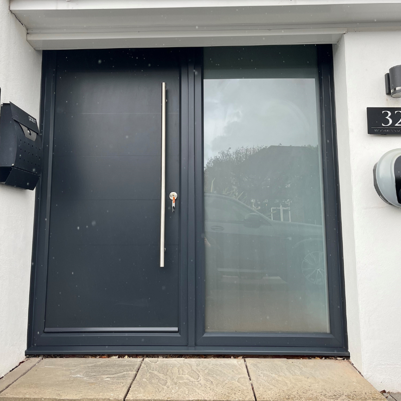 Modern front door in black and chrome